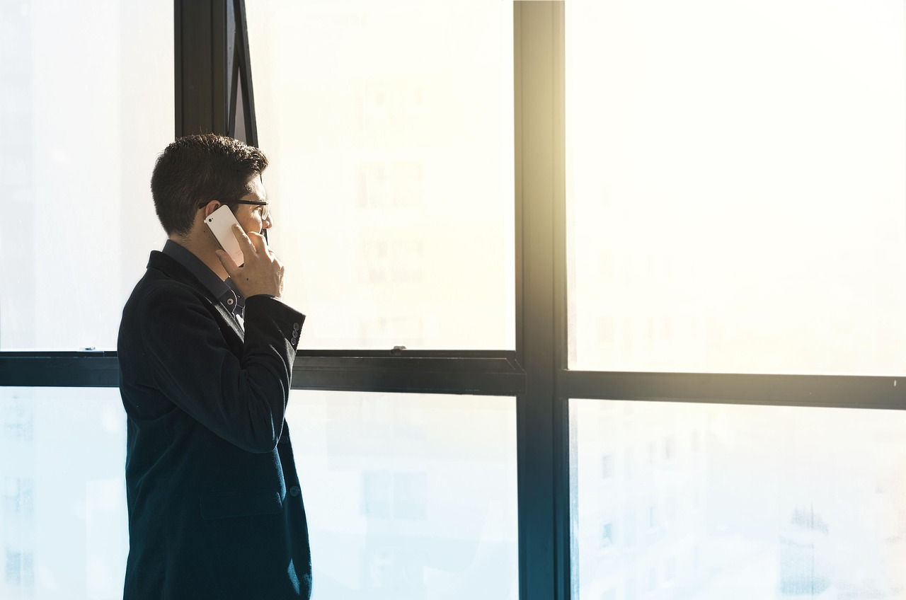 Man, cell phone, tuxedo — Craig Izenstark: Mastering Investment Strategy Through Three Decades of Market Experience