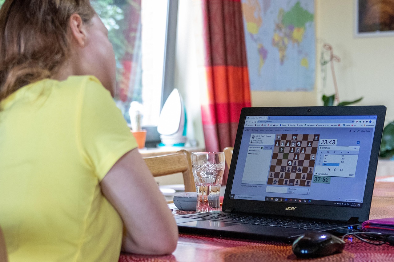 Online chess tournament, laptop, girl — The Indian Betting Advantage: Reasons to Choose Wisely