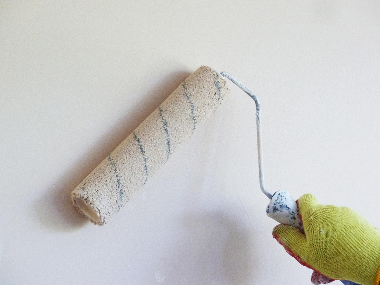 Painting, white wall, paint roller — Why Loft Ladders Are a Smart Investment for Storage Access